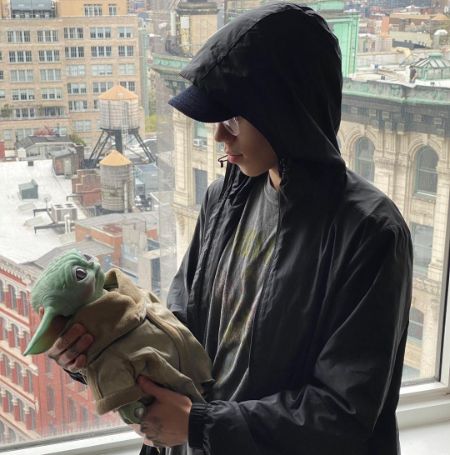 Ryan Adrian Muñiz posted a picture of him holding a Baby Yoda.